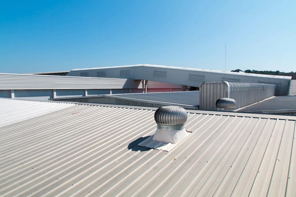 metal flat roof with background view of blue sky