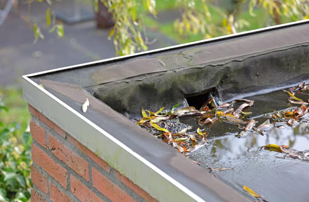 Water drainage on a flat roof, selective focus