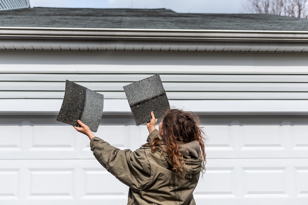 woman noticing roof damage before roof claim