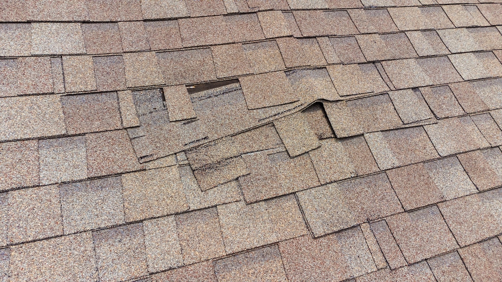 Roof Shingles damaged because of poor roof ventilation