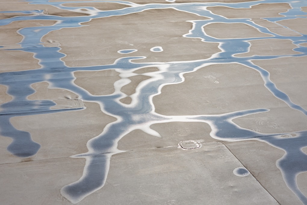 water pooling on built-up roofing