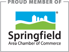 Springfield Area Chamber of Commerce" logo with blue sky, white houses and buildings, and green grass.