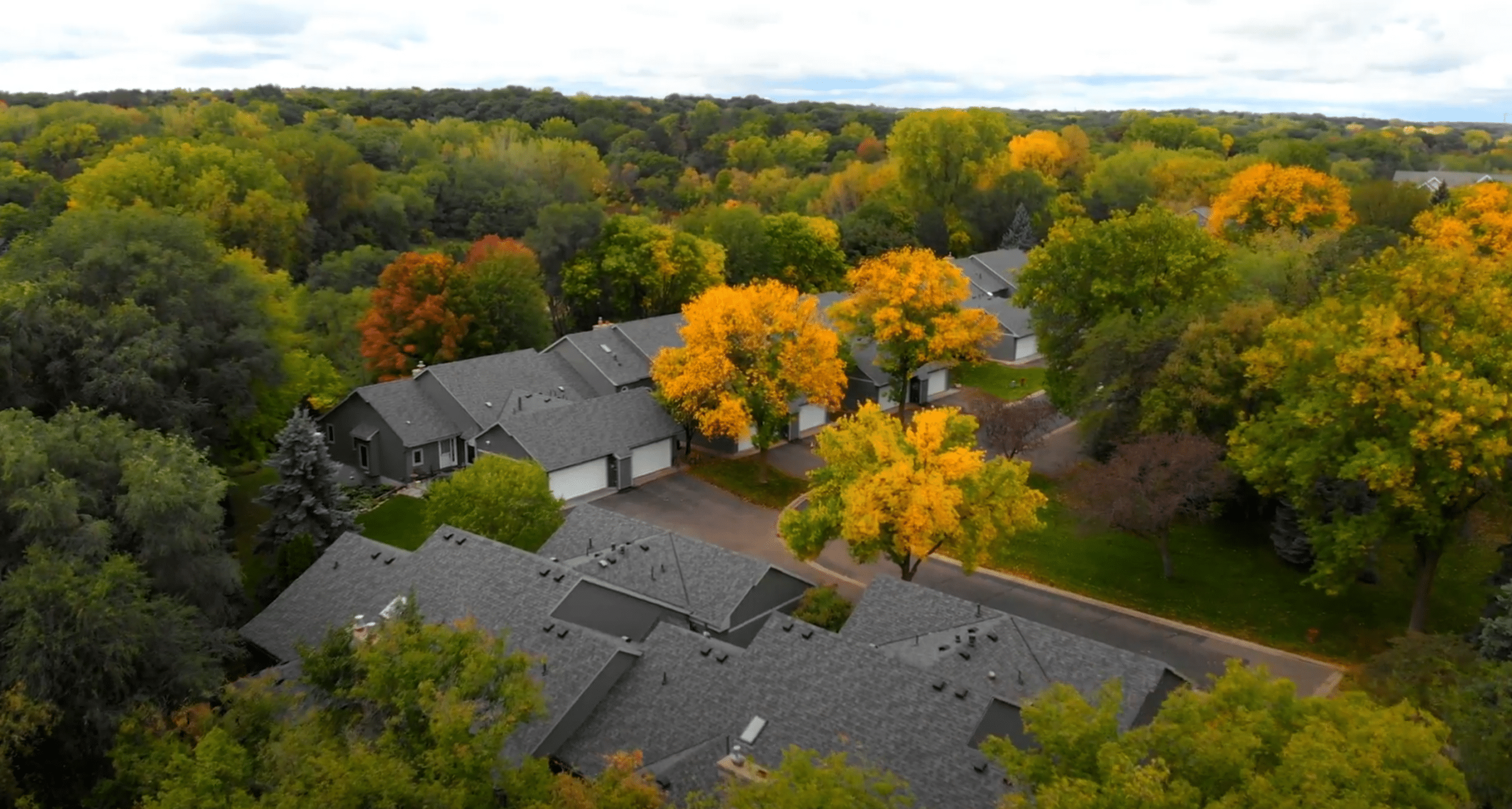 Aerial view of Windmill Ridge Townhomes undergoing roof and siding replacement.