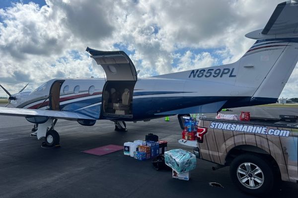 Pickup truck with supplies to be loaded onto a plane 