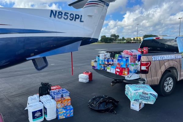 Pickup truck with supplies to be loaded onto a plane 