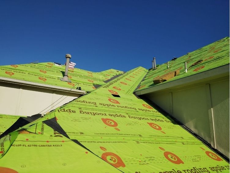 House roof with Apple Roofing underlayment