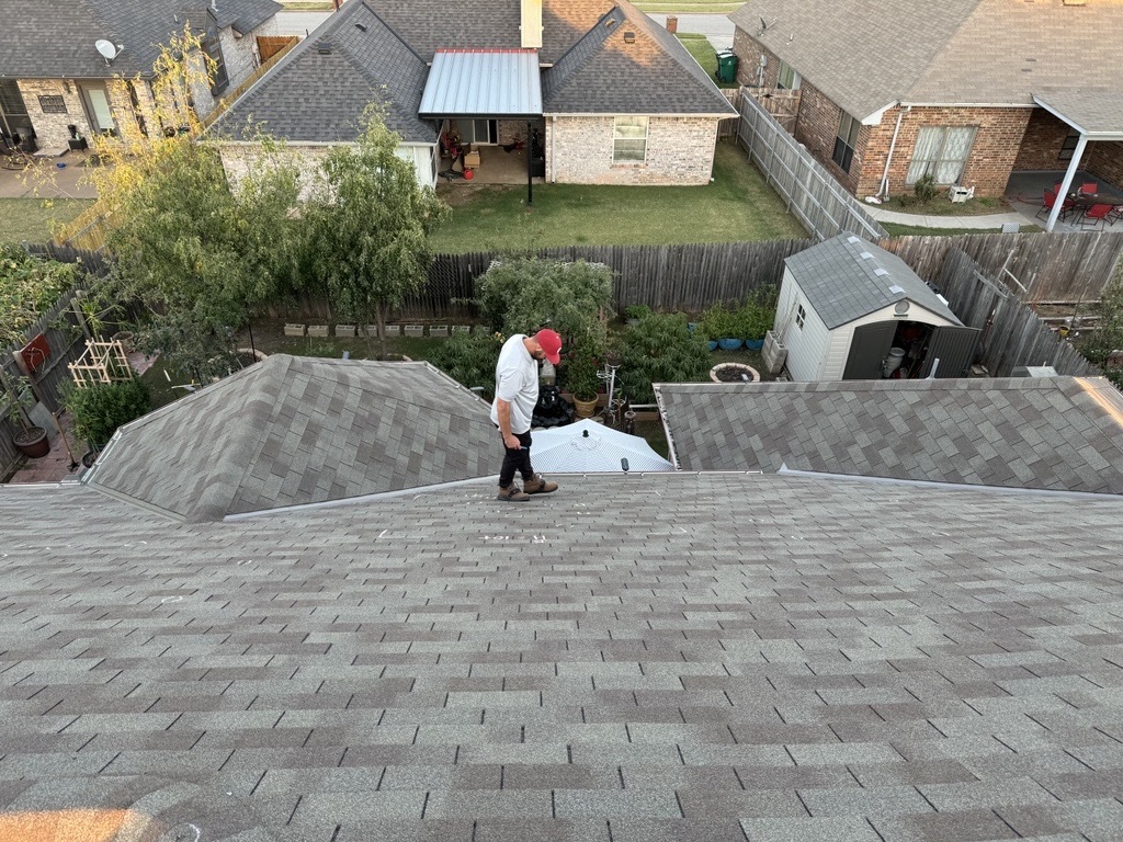 Landry Jones walking on a house roof during an inspection